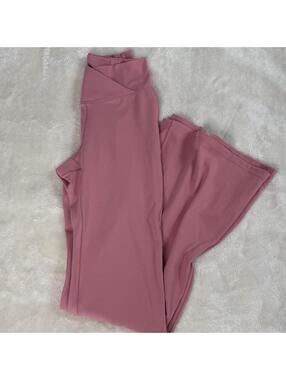Pink crossover flare leggings.